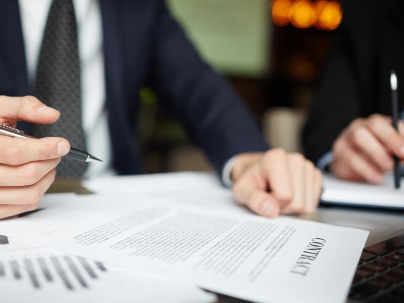Resolving disputes over liability for compensation under processing contracts